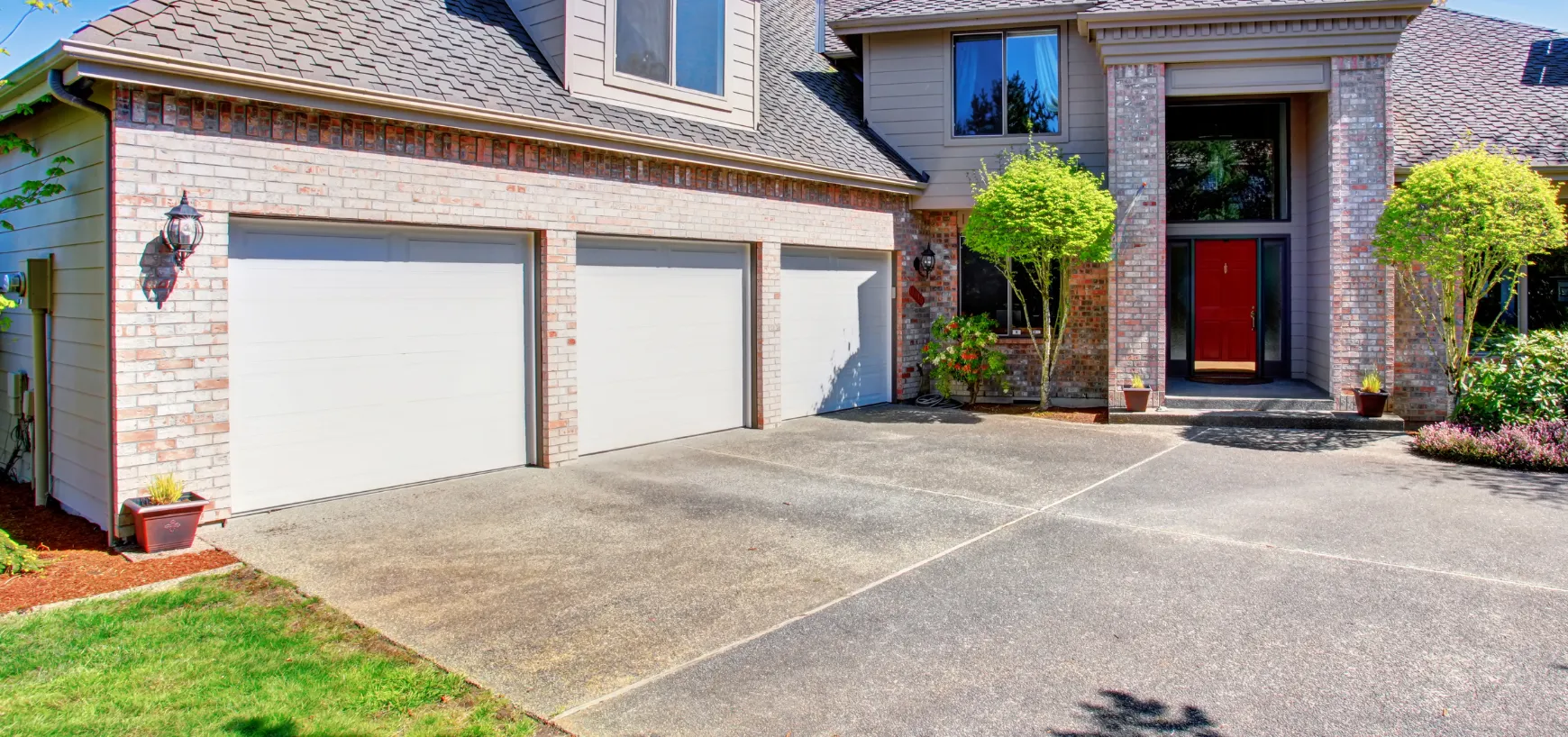 Damaged and cracked driveway concrete before removal in Dallas TX residential property