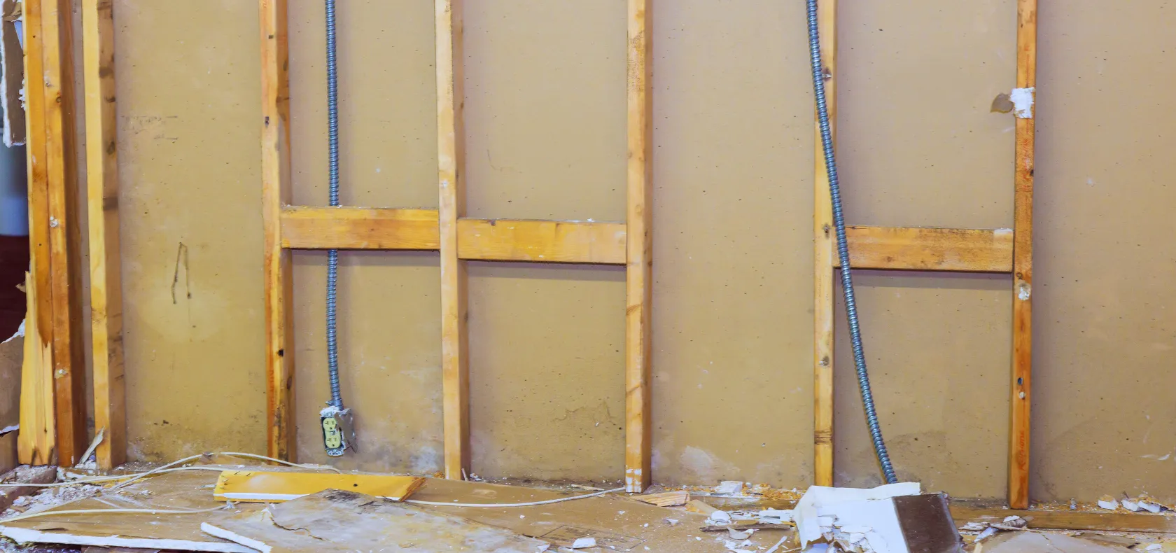 Residential interior demolition in Dallas TX showing exposed wall studs during home renovation preparation